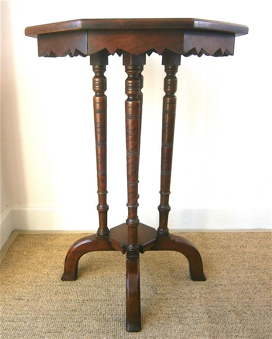 A Victorian mahogany octagonal table and a Liberty ebonised Hampden table Larger H.70cm